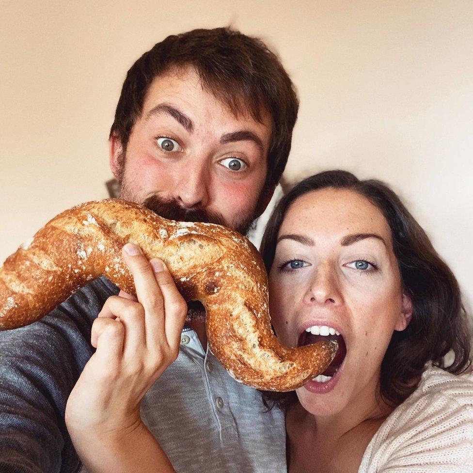 Sophia and Jesse eating a baguette