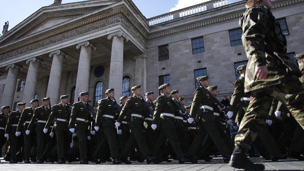 Members of the armed forces parade outside the GPO