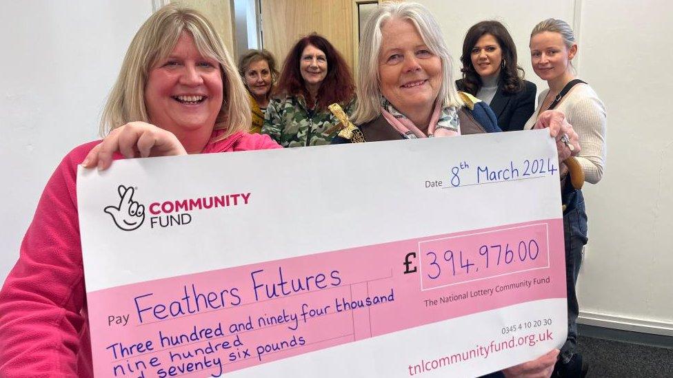 Great Yarmouth mayor Penny Carpenter presents a cheque for £394,000 to Jo Critch from Feathers Futures