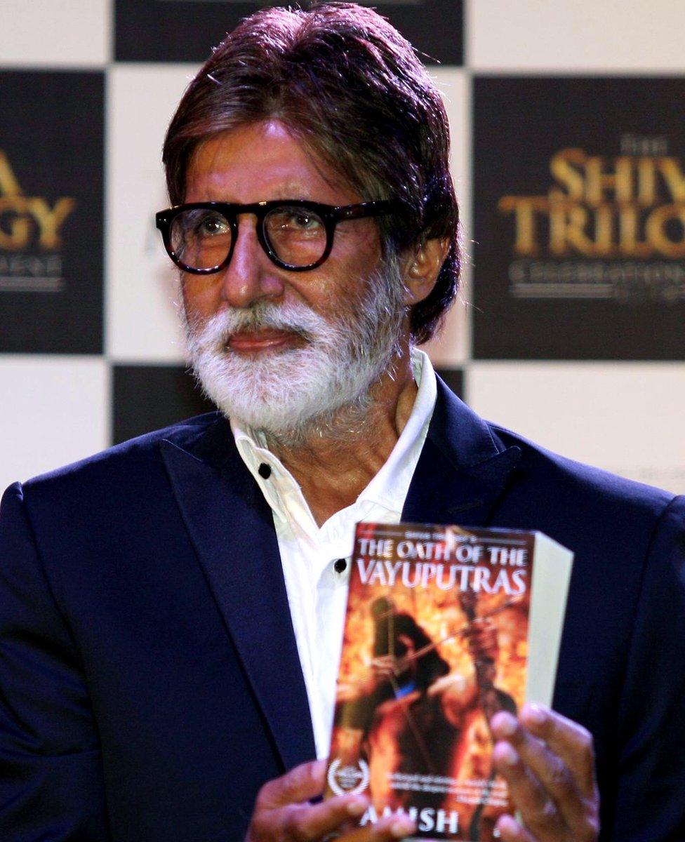 Bollywood superstar Amitabh Bachchan with a copy of one of Amish Tripathi's books