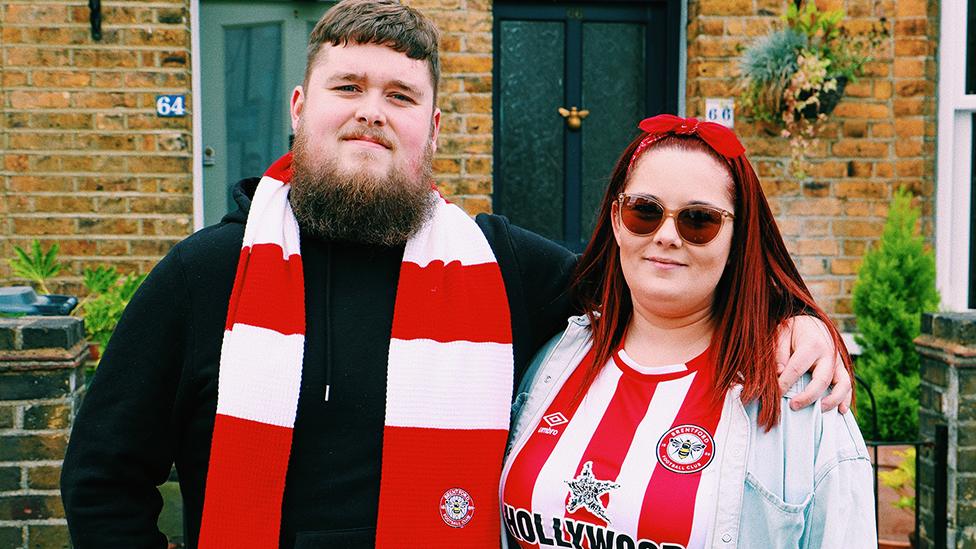 Two Brentford fans in kit