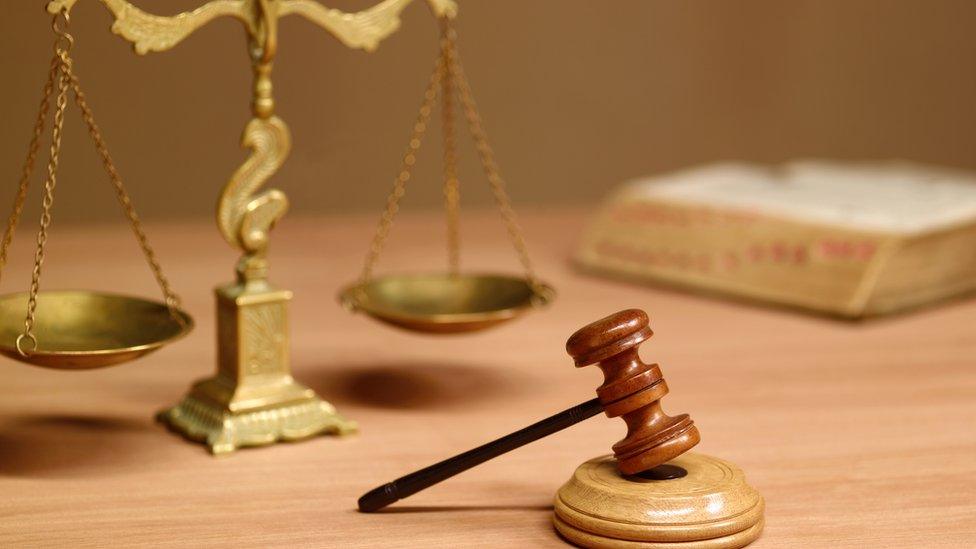 Judges desk in court room - stock photo