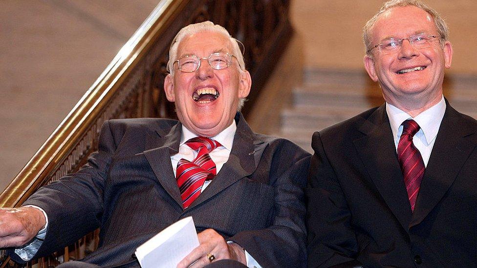 Ian Paisley and Martin McGuinness smile together at Stormont