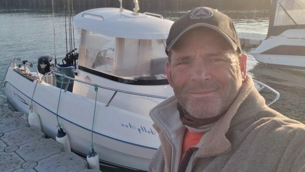 Justin Paull with his fishing boat, Sally Ann