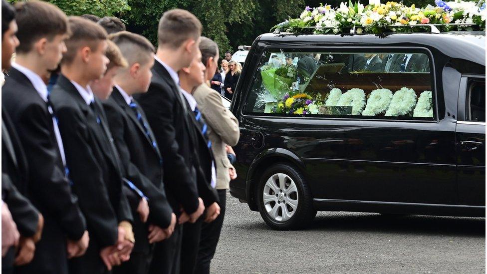 St Columb's College pupils form a guard of honour at the funeral service for Reuven Simon and Joseph Sebastian