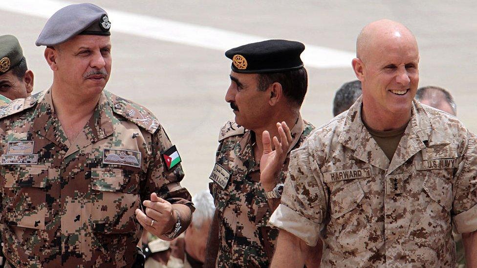 Jordan's Prince Faisal (L), Army's head of operations and training Major General Awni Adwan (C) and deputy commander of US Central Command, US Navy Vice Admiral Robert S. Harward (R) attend the 'Eager Lion' joint military exercise at the King Abdullah Special Operations Training Centre in Amman in 2012