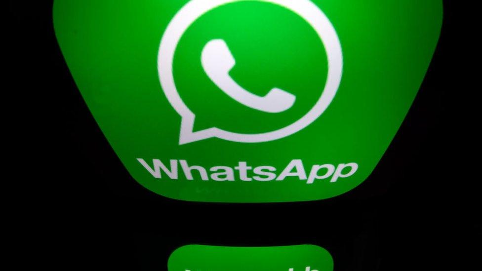 A picture taken on December 28, 2016 in Paris shows the logo of WhatsApp mobile messaging service