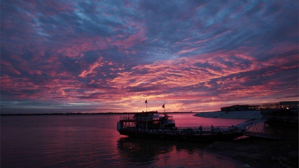 A ferry stops at the Mekong river bank before transporting villagers from Phnom Penh in Cambodia, on 2 September 2015.