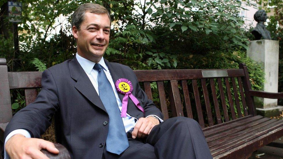 Nigel Farage sitting on a bench