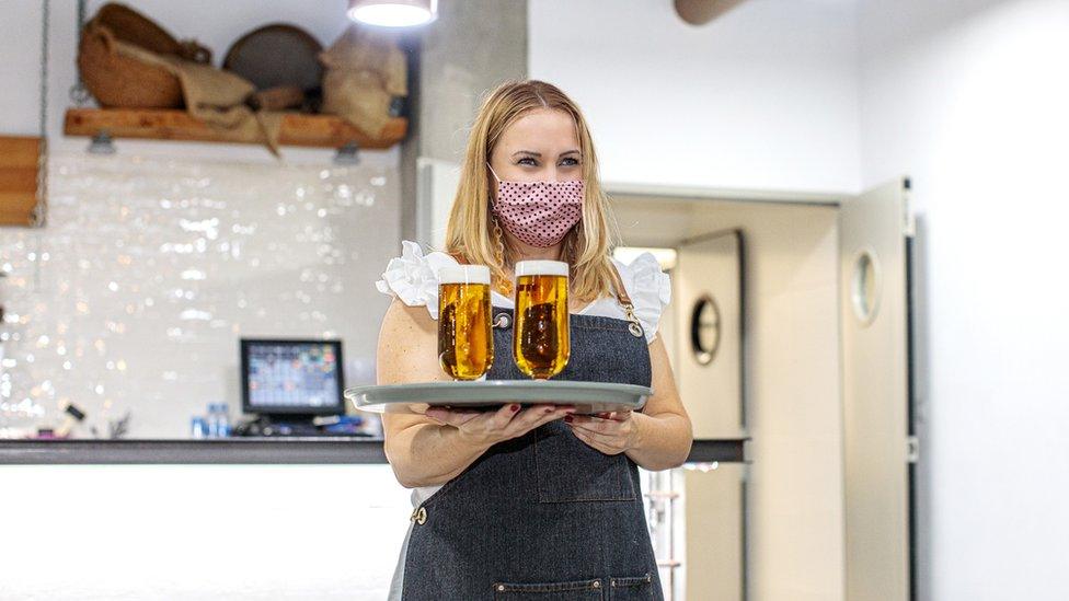 Waitress wearing face mask