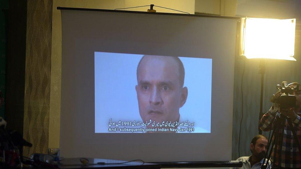 Members of the media watch a projection of a video showing arrested man Kulbhushan Jadhav, who is suspected of being an Indian spy, during a press conference in Islamabad on 29 March 2016