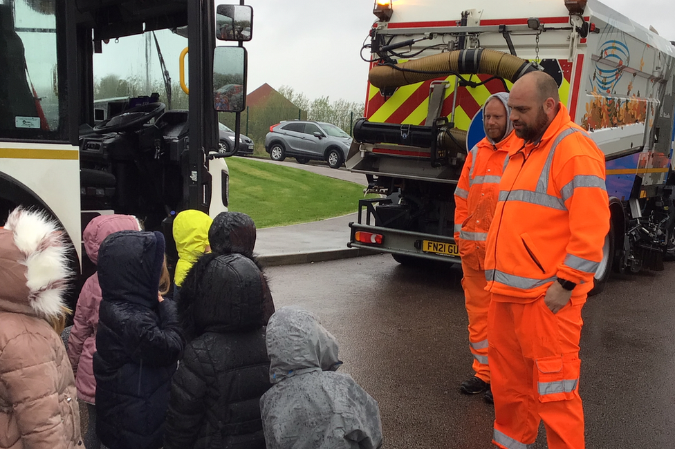 Children with refuse collectors