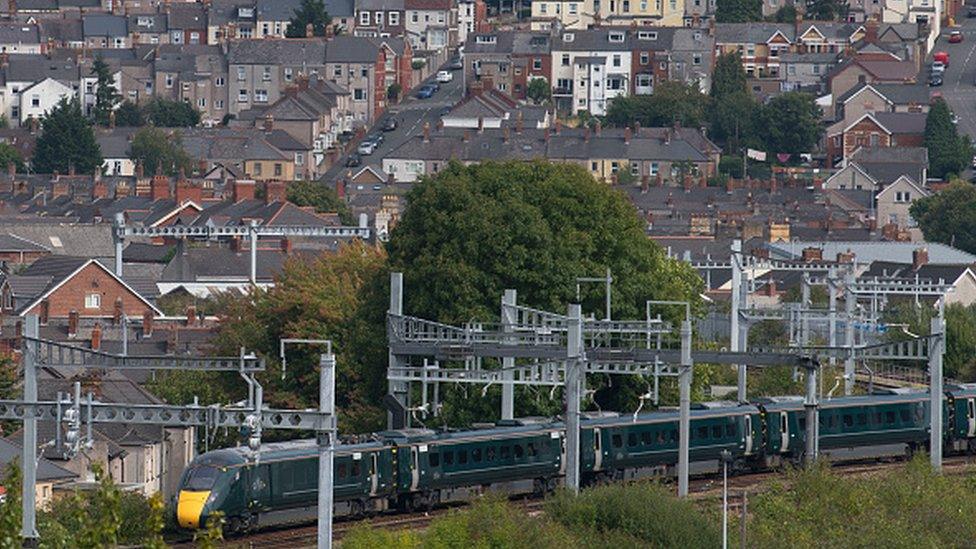 A First Great Western train near a residential area in Newport