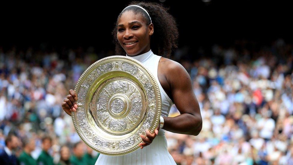 Serena Williams holding Wimbledon trophy