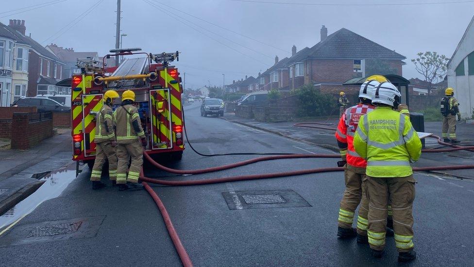 Firefighters outside the church