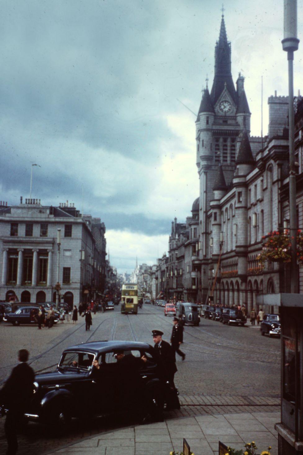 Aberdeen's Union Street with old cars and buses from the 1950s.