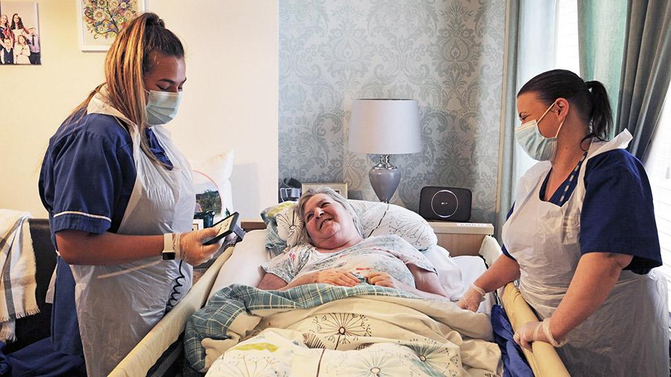 Care workers Jasmine Grey, left, and Linda Teasdale looking after pensioner Susan Dale