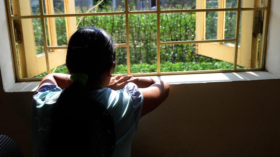 Girl looking out a window