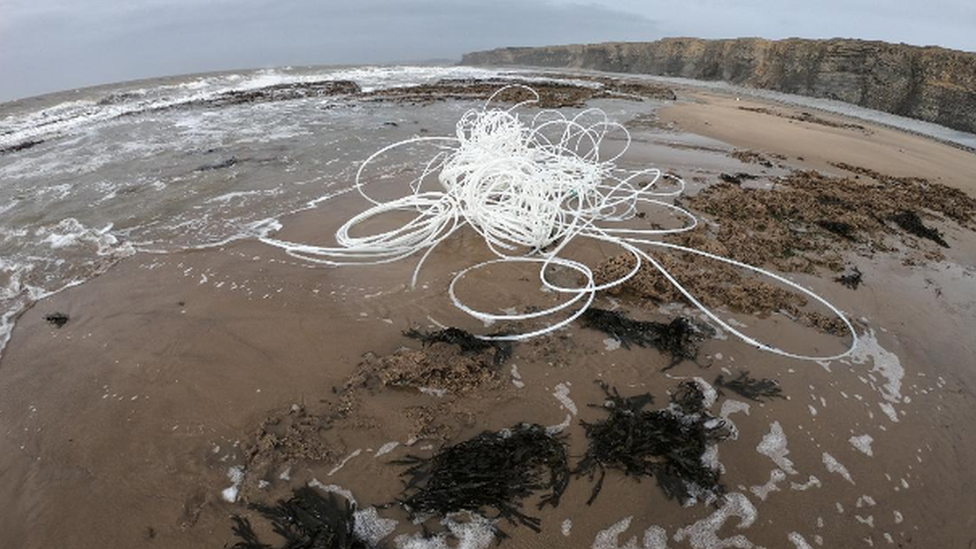 Plastic piping on the beach