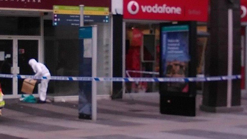 A shop doorway at the corner of Donegall Place and Castle Lane was cordoned off