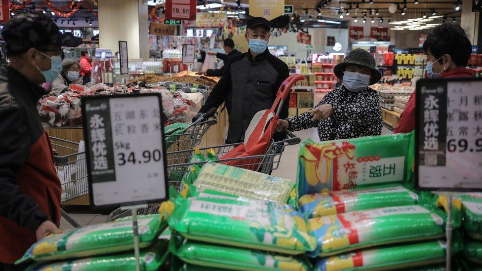 People shop in a supermarket in Beijing, China, 02 November 2021.