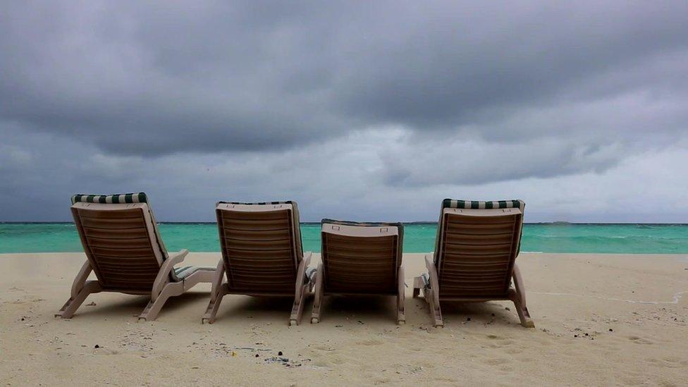 Deckchairs on a beach in Male