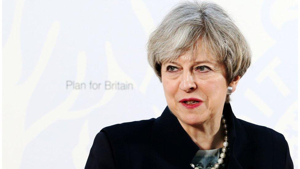 Britain's Prime Minister Theresa May delivers a speech at the Department for International Development's (DfID) office at Abercrombie House in East Kilbride