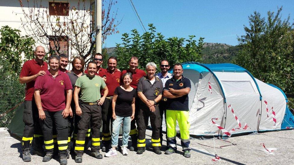 Maddalena with the Modena firefighters who set up a tent for her just after the quake