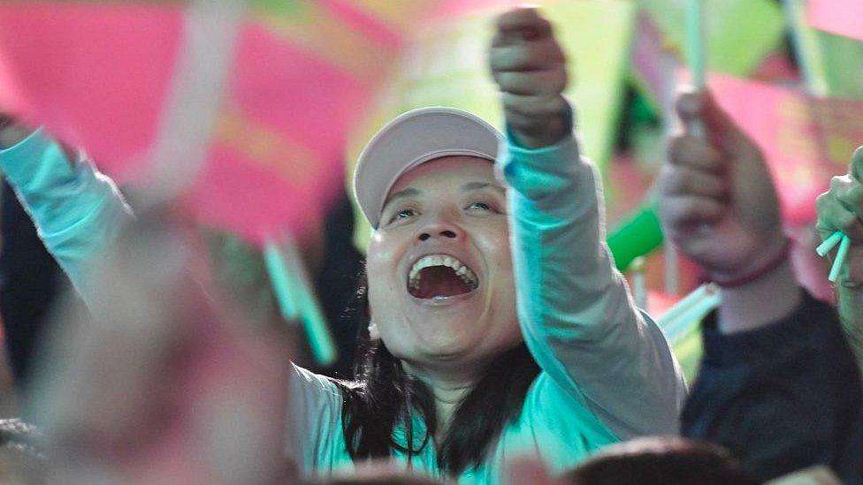 A supporter of Taiwan President Tsai Ing-wen reacts outside the campaign headquarters in Taipei on January 11, 2020