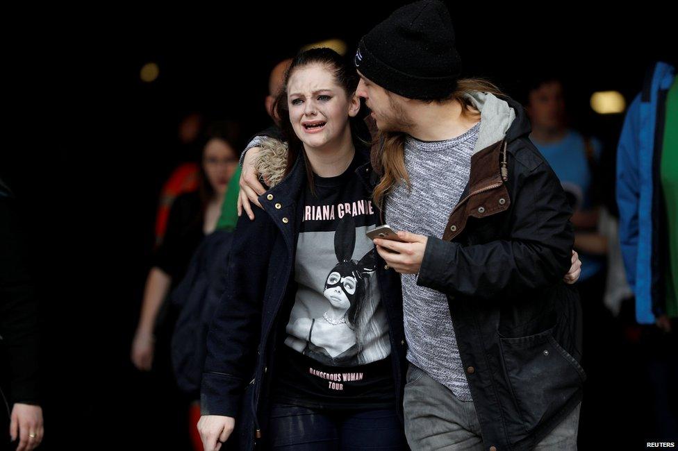 A young woman cries after the attack at the Manchester Arena