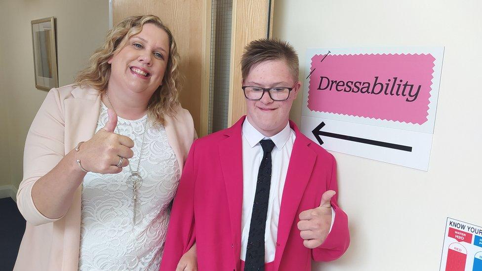 Claire and son Leo who is wearing the pink suit