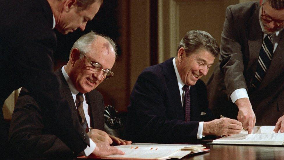 President Ronald Reagan and Soviet General Secretary Mikhail Gorbachev signing the arms control agreement banning the use of intermediate-range nuclear missiles