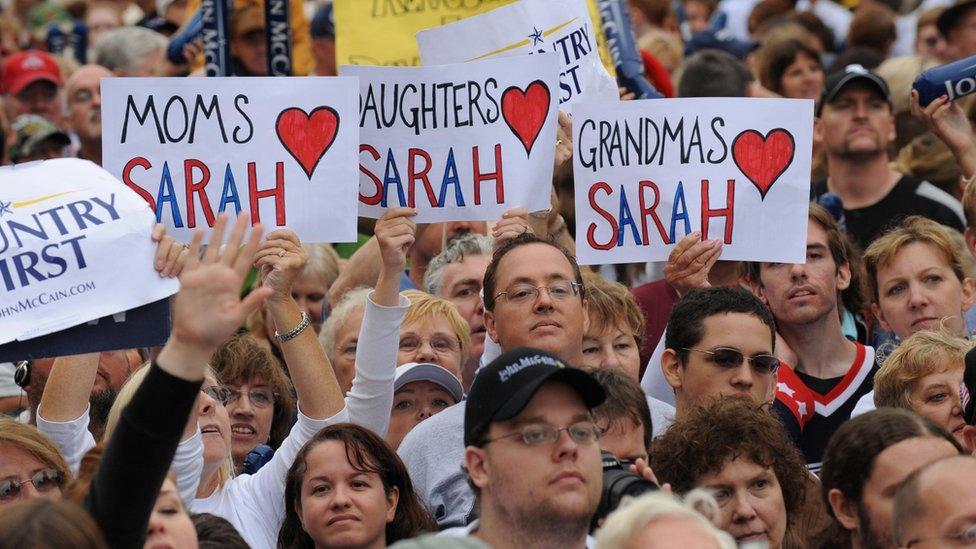 :Supporters hold signs at a ?McCain Street USA? campaign event by Republican presidential candidate Arizona Senator John McCain and his running mate Alaska Governor Sarah Palin, in Lebanon, Ohio on September 9, 2008