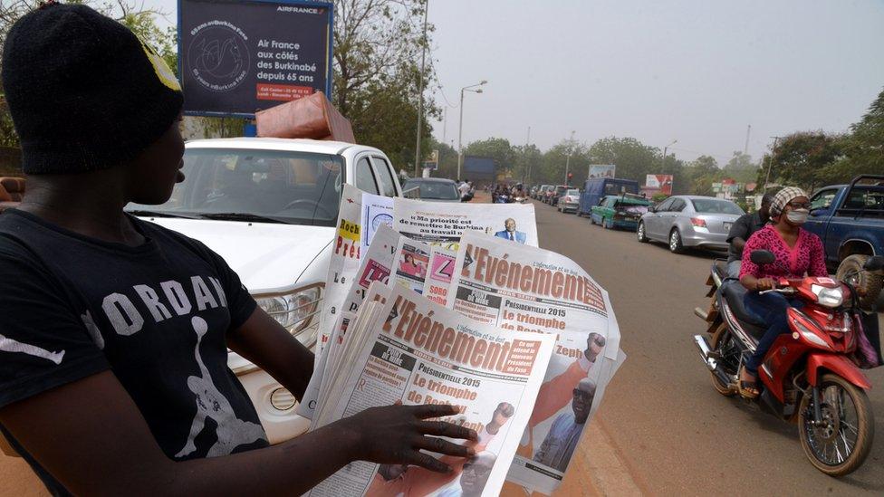 Newspaper vendor in Burkina Faso