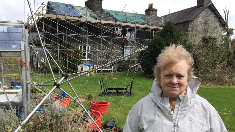 Farmer Deilwen Breese in front of her house