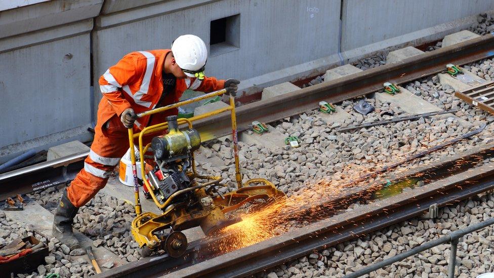 Worker on tracks