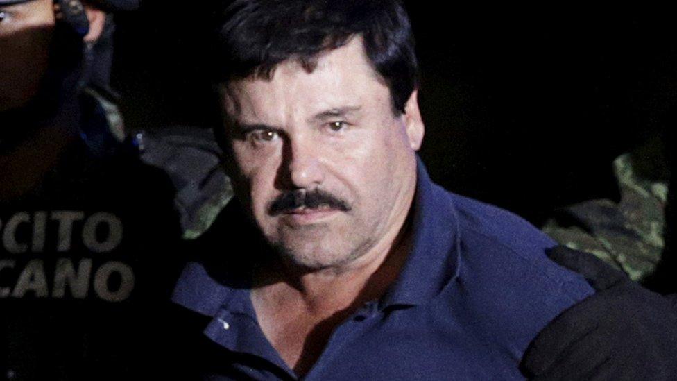 Cartel boss Joaquin "El Chapo" is escorted by soldiers