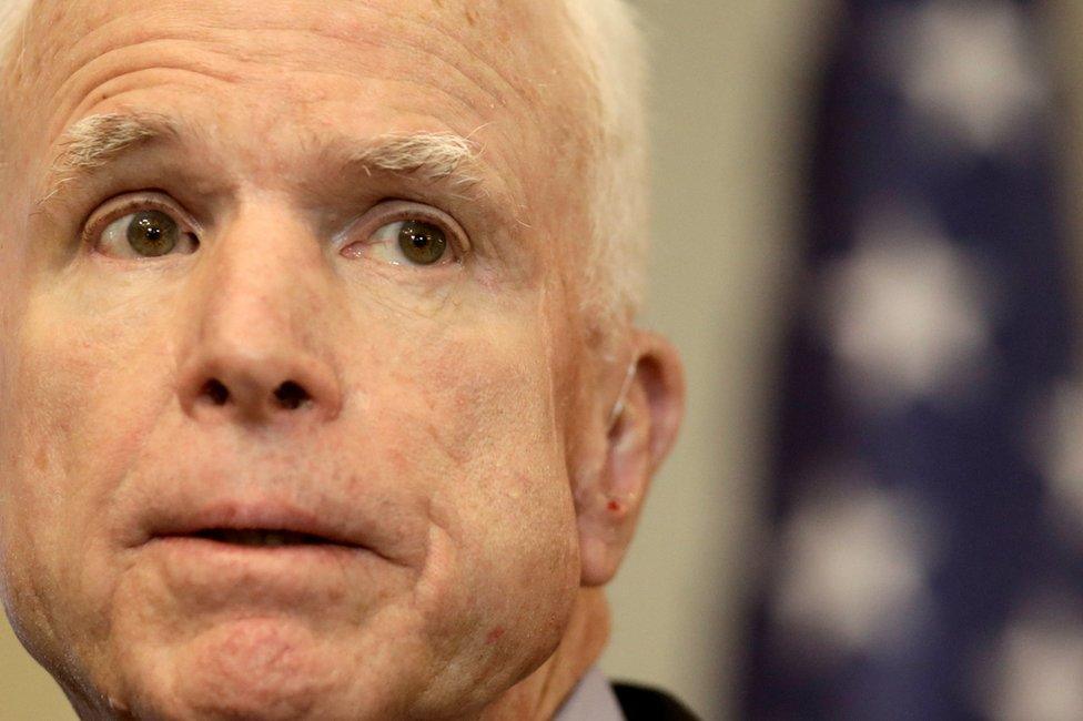 US Senator John McCain speaks during a news conference in Riga, Latvia, 28 December