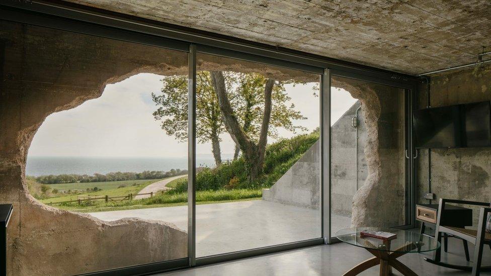 View from inside of converted concrete bunker looking out to sea