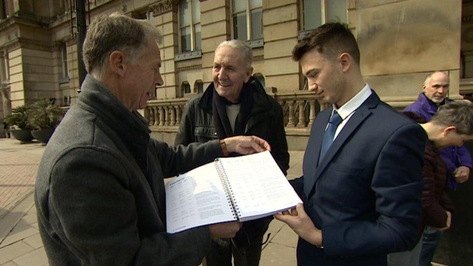 Hugh Porter, centre, with petition