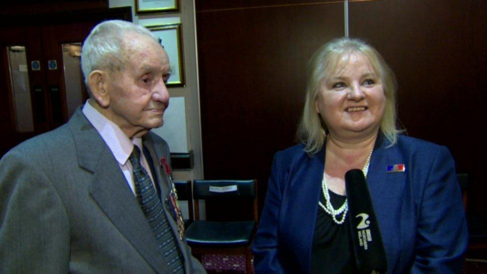 Ex Able Seaman Samuel McGookin with the France's honorary consul in Northern Ireland, Regine McCullough