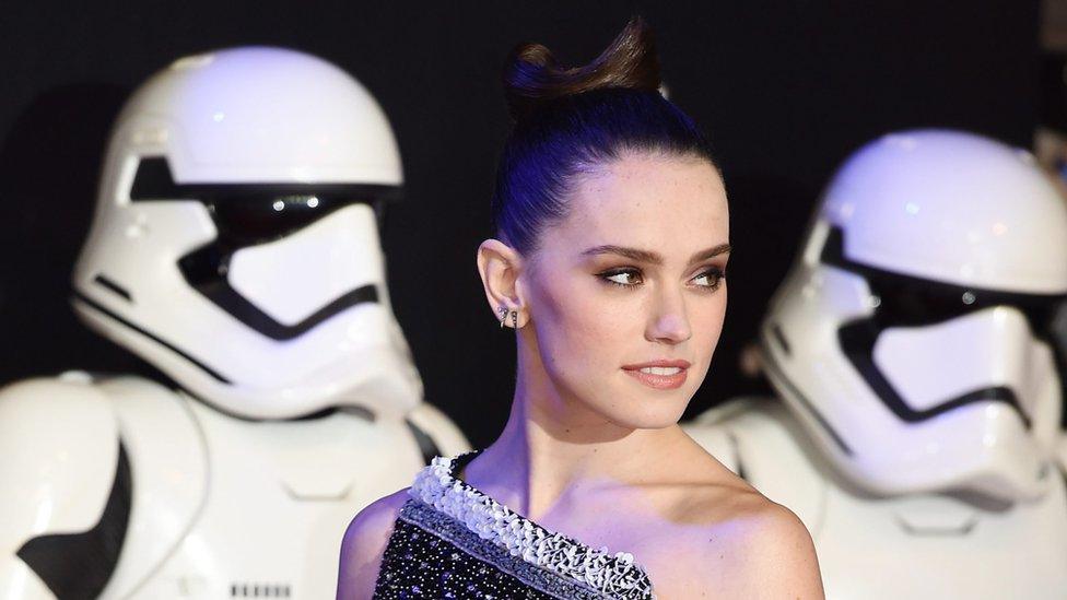 Daisy Ridley with Stormtroopers