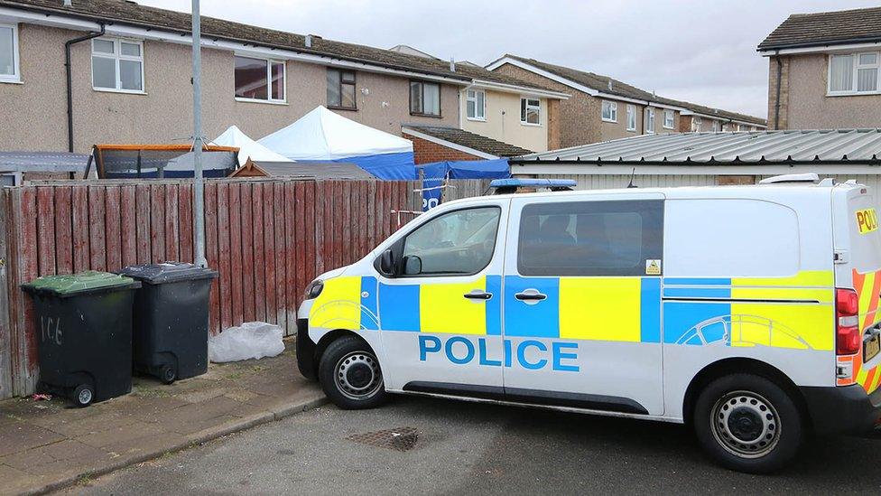 Police van behind houses in Biggleswade