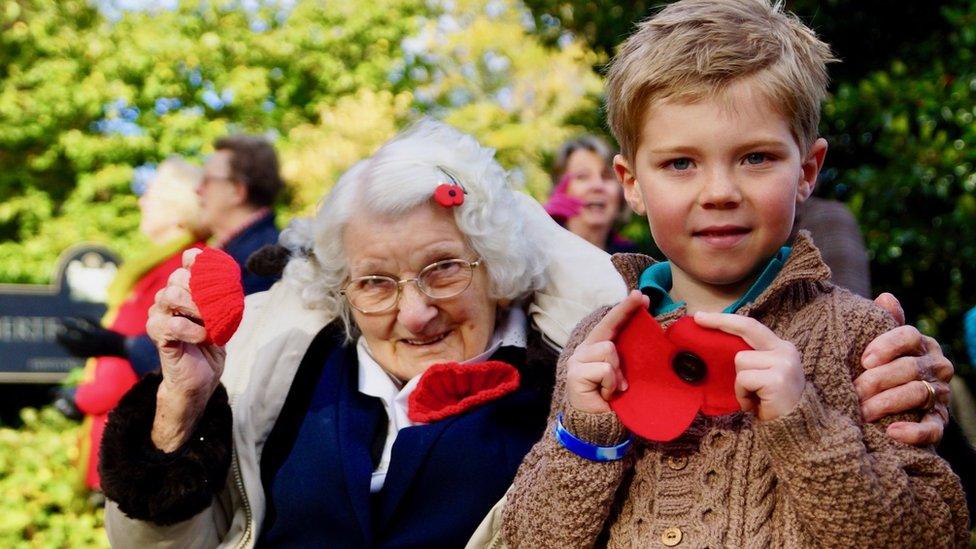 Ivy Buck and Bodhi Gover with wool poppies