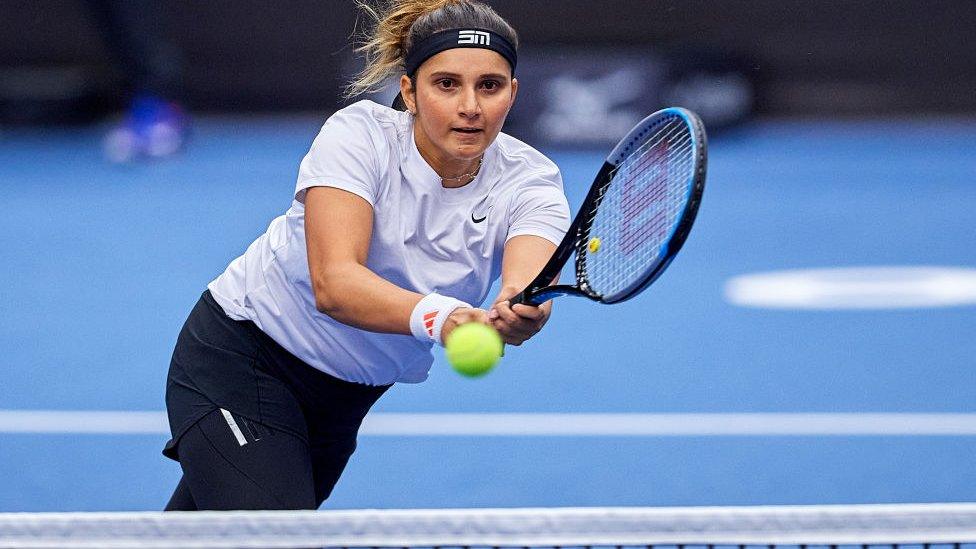 Sania Mirza from India plays a backhand against Eri Hozumi from Japan and Makoto Ninomiya from Japan in Semifinal Doubles match during Day 6 of the J&T Banka Ostrava Open 2021 on September 25, 2021 in Ostrava, Czech Republic