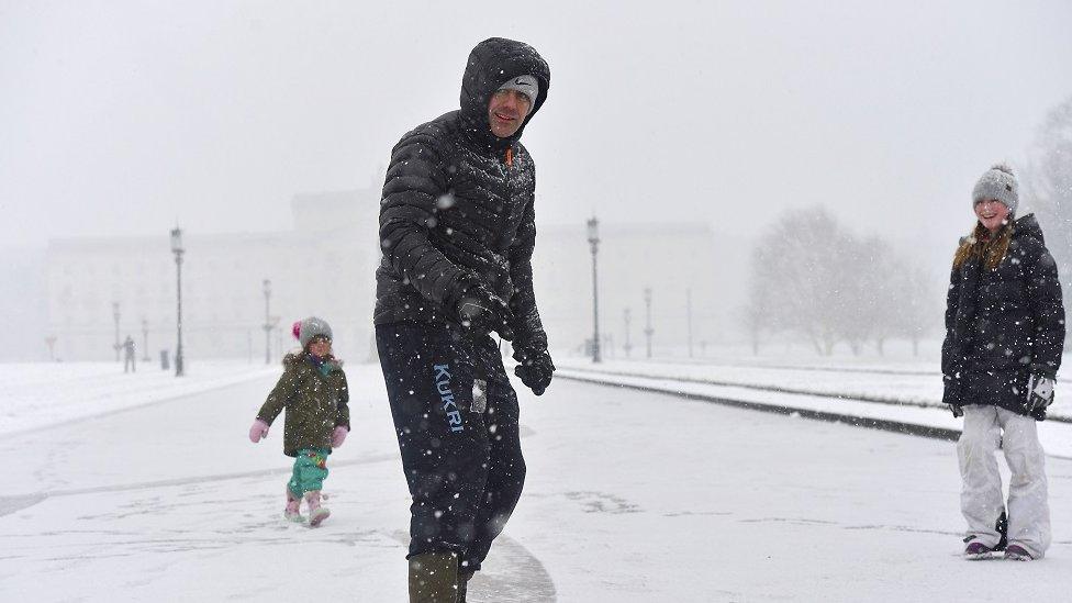 Snowboarders on Prince of Wales Avenue at Stormont