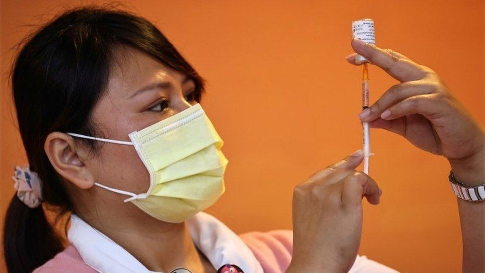 A nurse prepares a dose of the AstraZeneca vaccine against the coronavirus disease (COVID-19) during an organised media visit to the vaccination at Taoyuan Hospital in Taoyuan, Taiwan April 12, 2021.