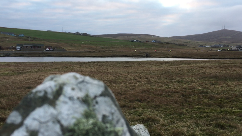 Runners in the distance on Bressay