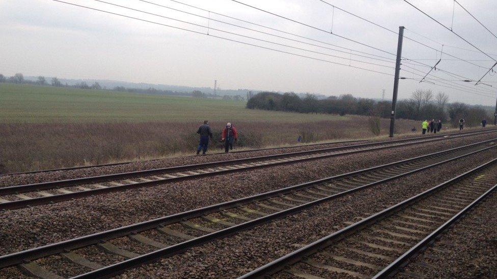 People on train track