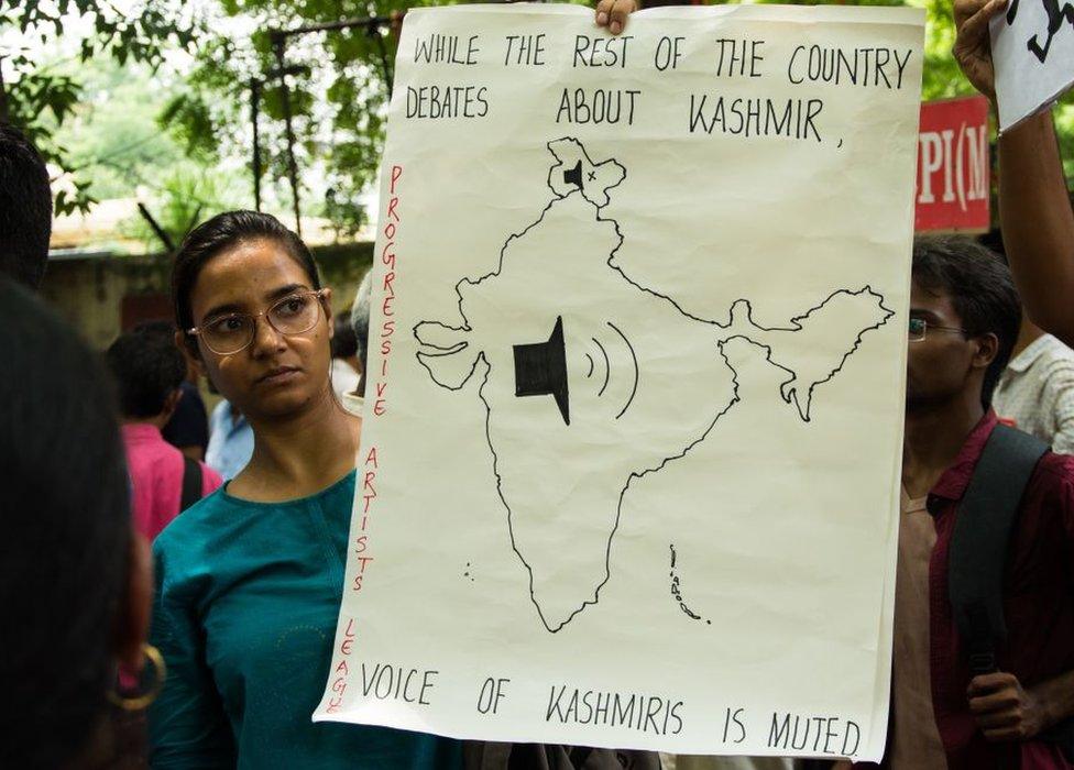 People attend a protest in solidarity with Kashmir over the removal of Article 370 and the forced shut down of all communication means in the valley in Delhi, India on August 07, 2019.